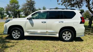 Toyota LandCruiser Prado TX  limited 2700cc (eco pro)
Model 2019/11 import  from japan April 2024 
Pearl white with beige leather interior 
Mileage  38000 km
Auction grade 4.5 A ( spotless condition)
7 seater  leather with sunroof 
Parktronic sensors & adopted Radar 
B&O sound system with 360 degrees cameras  front & rear 
Ambient lights
Wooden steering wheel  & full wooden interior 
Remote control smart starring & climate control access.
LED Xinon headlights with electric washers
Full body kit modilista & sport side skirts foot panels.
Crome package 
Full sports body kit available in the suv .
Further information please contact 11am to 10 pm & physically visit at Victory Cars jail road Lahore.