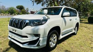 Toyota LandCruiser Prado 2700cc txl 
Model 2019 fresh import 2024 
Un-registered 
Pearl white metallic with beige leather interior 
Bumper to Bumper original condition ( spotless) 
7 seater with sunroof 
Multi power nappa leather electric seats 
Heated & cooling ( ventilated ) seats 
Cool box 
Multi zone duel climate control system 
B&o entertainment sound system
Multi cameras 
Adapted Radar 
Active line accessed 
Adapted cruise control 
Auto parking accessible 
All zone parktronic sensors 
Full  glossy wooden interior 
Full trd sport body kit 
Crome package 
Further information please contact & visit Victory Cars jail road Lahore