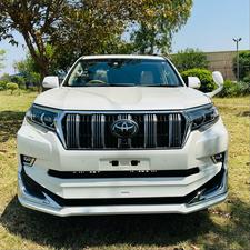 Toyota LandCruiser Prado 2700cc txl 
Model 2019 fresh import 2024 
Un-registered 
Pearl white metallic with beige leather interior 
Bumper to Bumper original condition ( spotless) 
7 seater with sunroof 
Multi power nappa leather electric seats 
Heated & cooling ( ventilated ) seats 
Cool box 
Multi zone duel climate control system 
B&o entertainment sound system
Multi cameras 
Adapted Radar 
Active line accessed 
Adapted cruise control 
Auto parking accessible 
All zone parktronic sensors 
Full  glossy wooden interior 
Full trd sport body kit 
Crome package 
Further information please contact & visit Victory Cars jail road Lahore