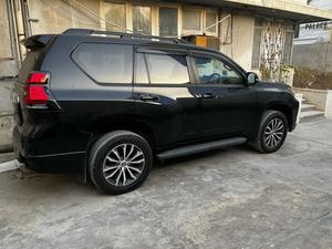 LandCruiser Prado TX-L 2700cc  
Model 2020  import April 2025 , unregistered 
Colour ,Pearl black with beige interior 
Top of line package 
Bumper to Bumper original ( spotless condition)
Auction grade 4.5 A 
7 seater with sunroof 
All electric nappa leather beige seats 
Front seat heated & cooling ( ventilated air conditioning )
Cool box 
Adapted Radar & cruise control 
Line accessed & blind spot monitor 
Multi camera & original dealer navigation.
Original TRD sports body kit 
19 inches TRD alloy wheels 
Further information please call & visit at Victory Cars jail road Lahore.