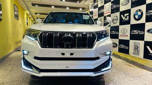 Toyota LandCruiser Prado TX-L 
Mode 2019 fresh import ( unregistered)
Mileage 33000 km
Pearl white with beige leather interior 
Brand new condition ( spotless)
Auction grade 4.5
7 seater with sunroof 
Top of line specs.
Nappa leather multi power seats with heated & ventilated ( air conditioning)
B/o premium entertainment sound system.
Multi cameras 
Customised fitting 
Crome package 
8 zone climate control air conditioning system 
Adapted active Radar 
Line accessed 
Adapted cruise control system 
All zone parktronic sensors 
Full body kit
18” alloy wheels with new tyres.
Further information please call & visit at Victory Cars jail road Lahore.