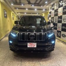 Toyota LandCruiser Prado TXL 2700cc eco/pro.
Model 2020 import April 2025
Brand New vehicle ( spotless condition )
Mileage 49000 km
Auction grade 4.5 A 
Silky black with ash white interior 
Top of the line specs,
All 7seats nappa leather 
Heated & ventilated ( air conditioning) seat 
Glass electric sunroof 
All zone climate control air conditioning 
Adapted Radar 
Active line accessed & blind spot monitor.
Adaptive cruise control 
Premium sound system with 16 speakers 
Cool box 
Full trd original body kit 
19” alloy wheels 
Crome package 
Further information please call & visit at Victory Cars jail road Lahore