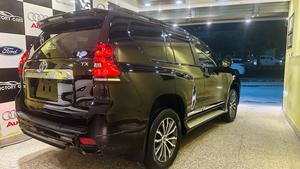 Toyota LandCruiser Prado TXL 2700cc eco/pro.
Model 2020 import April 2025
Brand New vehicle ( spotless condition )
Mileage 49000 km
Auction grade 4.5 A 
Silky black with ash white interior 
Top of the line specs,
All 7seats nappa leather 
Heated & ventilated ( air conditioning) seat 
Glass electric sunroof 
All zone climate control air conditioning 
Adapted Radar 
Active line accessed & blind spot monitor.
Adaptive cruise control 
Premium sound system with 16 speakers 
Cool box 
Full trd original body kit 
19” alloy wheels 
Crome package 
Further information please call & visit at Victory Cars jail road Lahore