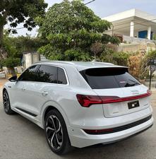 AUDI ETRON 50 QUATTRO TOP OF THE LINE (230KW)
Model 2022 || Registration 2022 
Choice Registered *800*
10,000 miles Driven 
Audi Maintained 
White Color
Bruno Interior
Bumper to Bumper Original Paint 100%
Scratch-less & Spotless
FULL HOUSE 
Just as good as Brand New   
Original TV 
Original Rims 
Still Smells like zero meter 
SEE TO BELIEVE 
READY DELIVERY 
EXCHANGE POSSIBLE WITH ANY CAR

For inspection
Available at SUPREME CARS
Plot # 151/F,Under Imam heights,Shop no.1&2, Main Khalid Bin Walid Rd, Karachi, Sindh 75400

|  Premium Cars |  Best Prices |  Optimum Performance | 
#supremecarsgang