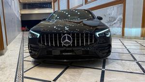 Mercedes-Benz CLA200  AMG -S ( twin turbocharged ) night black package 
Model 2021 registered 2022 in Islamabad 
Shahnawaz import.
Pearl black metallic with twin shadesd Dezine line AMG leather interior 
Mileage 24000 km
Bumper to Bumper original & spotless condition 
Top of line customised specs. 
Memory package, 14 electric power seats ejectment , heated & ventilated seats 
AMG spot bucket seat 
Multi zone climate control air conditioning 
Burmaster pro. surround sound entertainment system 
Panoramic electric sunroof 
Head up display 
Multi massager seats package 
Telescopic electric steering wheel 
Paddle shifter 
Adapted cruise controls 
Radar & adapted line accessed 
360 degrees cameras 
Multi zone auto parktronic package 
64 colours ambient lights interior 
Perfume package 
Multi driving modes eco, individual, sport, sport + & comfort.
Privacy glass package 
AMG sport suspension 
Wireless charger 
Wireless Apply CarPlay & android apps 
AMG muffler with change sound 
19 “ AMG sport alloy wheels 
Full AMG body kitted 
GT line front grill
Flat screen o led smart cluster 
Adapted led laser headlights 
Further information please call & visit at Victory Cars jail road Lahore.