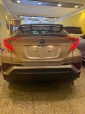 Toyota CH-R  1800cc hybrid 
G-led package 
Model 2019 fresh import 
Mileage 56000 km
Verified Auction sheet 
Pearl Bronze metallic colour with brown leather interior .
Bumper to Bumper original condition ( spotless)
Top of the line package 
Multi cameras 
Apple CarPlay, Bluetooth & android app. With 11 speakers 
Adapted Radar 
Blind spot monitor 
Line accessed 
Adapted cruise control 
19” alloy wheels 
Future information please call & visit Victory Cars jail road Lahore.