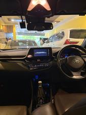 Toyota CH-R  1800cc hybrid 
G-led package 
Model 2019 fresh import 
Mileage 56000 km
Verified Auction sheet 
Pearl Bronze metallic colour with brown leather interior .
Bumper to Bumper original condition ( spotless)
Top of the line package 
Multi cameras 
Apple CarPlay, Bluetooth & android app. With 11 speakers 
Adapted Radar 
Blind spot monitor 
Line accessed 
Adapted cruise control 
19” alloy wheels 
Future information please call & visit Victory Cars jail road Lahore.