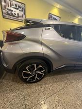 Toyota CH-R  1800cc hybrid 
G-led package 
Model 2019 fresh import 
Mileage 56000 km
Verified Auction sheet 
Pearl Bronze metallic colour with brown leather interior .
Bumper to Bumper original condition ( spotless)
Top of the line package 
Multi cameras 
Apple CarPlay, Bluetooth & android app. With 11 speakers 
Adapted Radar 
Blind spot monitor 
Line accessed 
Adapted cruise control 
19” alloy wheels 
Future information please call & visit Victory Cars jail road Lahore.