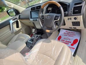 Fresh Import 2025
TX L Package
Wooden Steering 
New Transmission 
(Leather Electric Heating & Cooling Seats)
Colour: Pearl White
2020 Model
Low Mileage: 20268 KM
Beige Interior
7 Seats
19 Inches Original Alloy Rims
Sunroof
Toyota Genuine Navigation System
Toyota Genuine TV
Toyota Genuine Back Camera
No.1 Japan Quality
5 AA Auction Grade And Genuine Verifiable Auction Sheet
Auction Sheet Attach For Satisfaction And Verification
Modelista Genuine Body Kit (Front & Back)
Genuine New Model
Genuine New Interior
Prado Super Live Sound System
14 Speaker
Shiny Pearl White Color
Intelligent Entertainment
Digital TV
Led Head Lamp
100% Original
4WD,ETC
Multi-Function Steering Controls
Fog Lamps
Genuine New Front Grill
Steering Gear Type: Rack & Pinion Type With Power Assist
Retractable Side Mirrors With Indicators
All Windows Full Automatic (One Touch Up/down)
Immobilizer (Anti-theft)
Digital Climate Control A/c & Heater
Rain Visors
8 Airbags