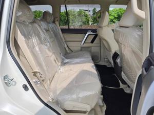 Fresh Import 2025
TX L Package
Wooden Steering 
New Transmission 
(Leather Electric Heating & Cooling Seats)
Colour: Pearl White
2020 Model
Low Mileage: 20268 KM
Beige Interior
7 Seats
19 Inches Original Alloy Rims
Sunroof
Toyota Genuine Navigation System
Toyota Genuine TV
Toyota Genuine Back Camera
No.1 Japan Quality
5 AA Auction Grade And Genuine Verifiable Auction Sheet
Auction Sheet Attach For Satisfaction And Verification
Modelista Genuine Body Kit (Front & Back)
Genuine New Model
Genuine New Interior
Prado Super Live Sound System
14 Speaker
Shiny Pearl White Color
Intelligent Entertainment
Digital TV
Led Head Lamp
100% Original
4WD,ETC
Multi-Function Steering Controls
Fog Lamps
Genuine New Front Grill
Steering Gear Type: Rack & Pinion Type With Power Assist
Retractable Side Mirrors With Indicators
All Windows Full Automatic (One Touch Up/down)
Immobilizer (Anti-theft)
Digital Climate Control A/c & Heater
Rain Visors
8 Airbags