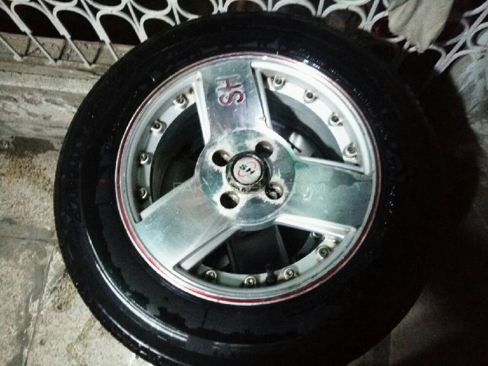 New condition Bridgestone tyre with alloyrims  Image-1
