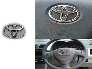 Slide toyota corolla steering logo emblem chrome for 2009 2014 34952858