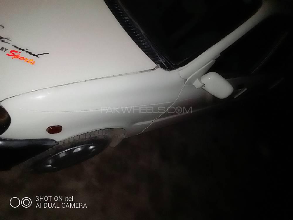 Daihatsu Cuore 2004 for Sale in Faisalabad Image-1