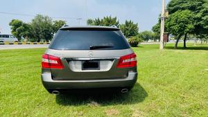 Mercedes-Benz E 350 estates 4matic V6 37000 cc AMG spec.
Model 2010 registered 2010 Karachi 
Mileage 53000 km
Shahnawaz import & mentioned 
Bumper to bumper original paint ( spotless condition)
Metallic brown with beige leather interior 
Panoramic sunroof 
Harmon/kardon entertainment sound system 
Self levelling air matic suspension & Hight control 
Active cruise control 
8 zone duel climate control air conditioning 
Full AMG body kit
AMG alloy wheels 
LED daylight wd active Xinon headlights 

Further information please contact 11am to 10 pm & physically visit at Victory Cars jail road lahore